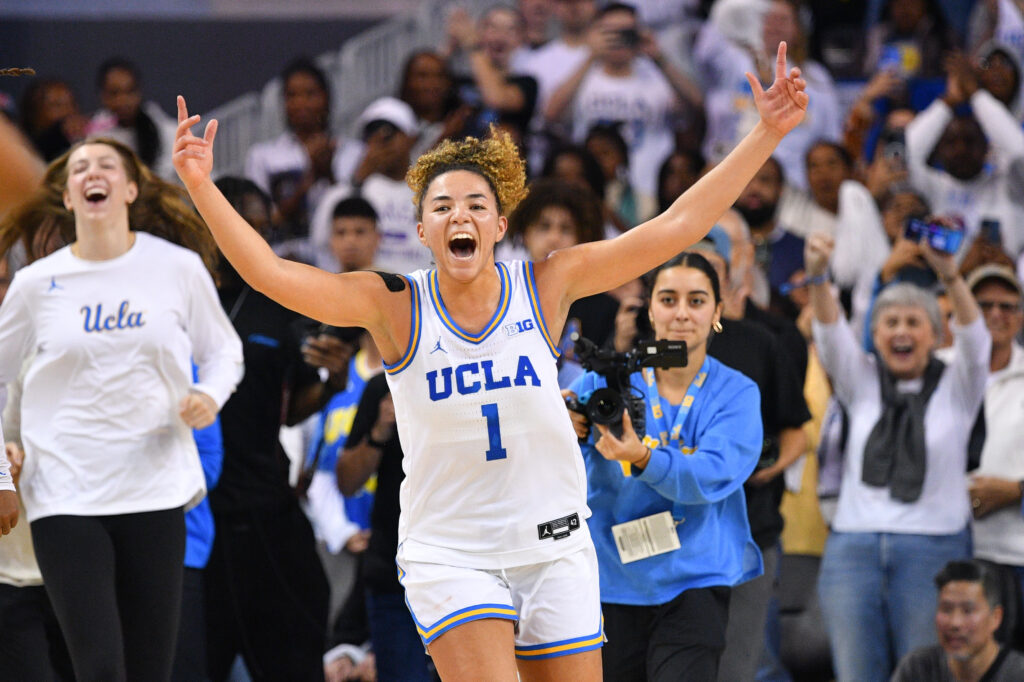 Guard Kiki Rice celebrates UCLA's first-ever upset win over a No. 1 team on Sunday.