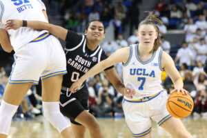 UCLA's Elina Aarnisalo dribbles past South Carolina's Te-Hina Paopao in Sunday's NCAA basketball upset win.