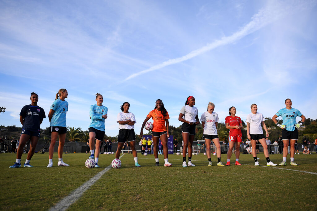 The 2023 NWSL Skills Challenge participants line up before the competition.