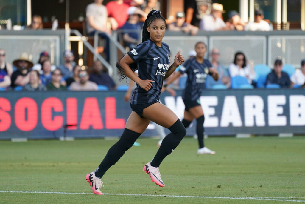 Washington rookie Croix Bethune runs across the pitch in a match.