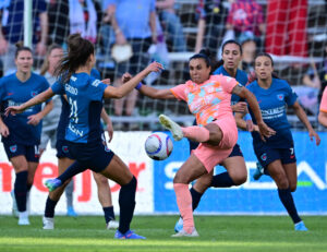 Orlando attacker Marta battles Chicago midfielder Julia Grosso for the ball in an NWSL game.