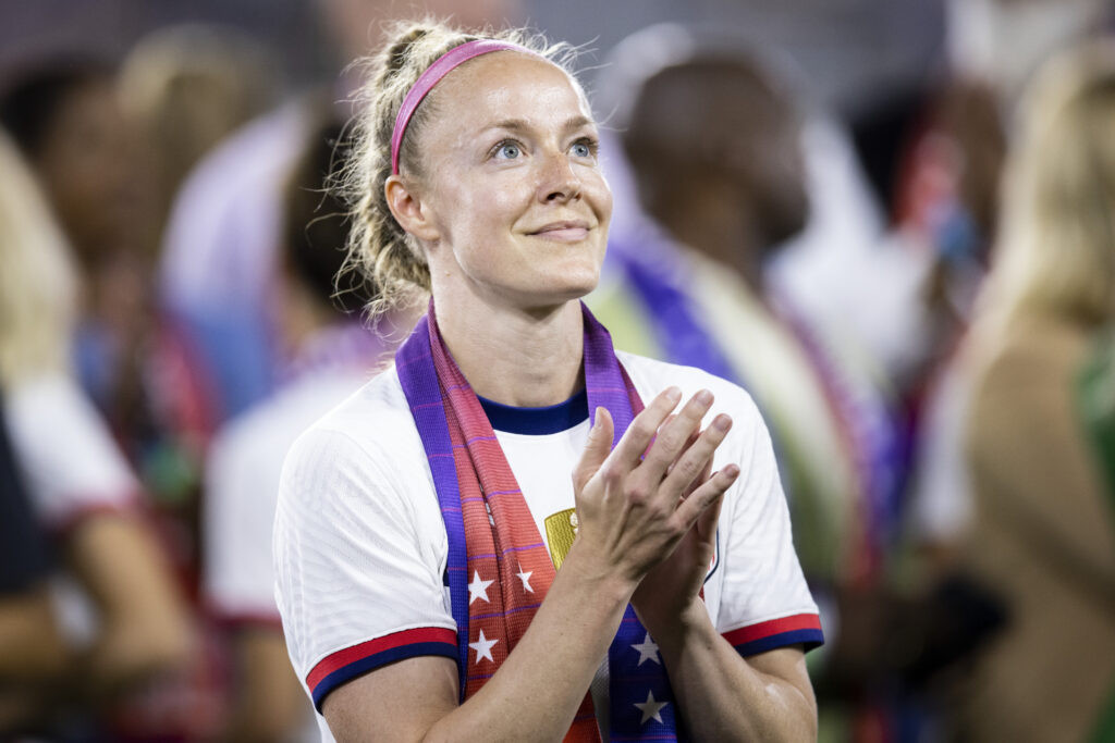 USWNT captain Becky Sauerbrunn applauds an equal pay video at the 2022 CBA signing.