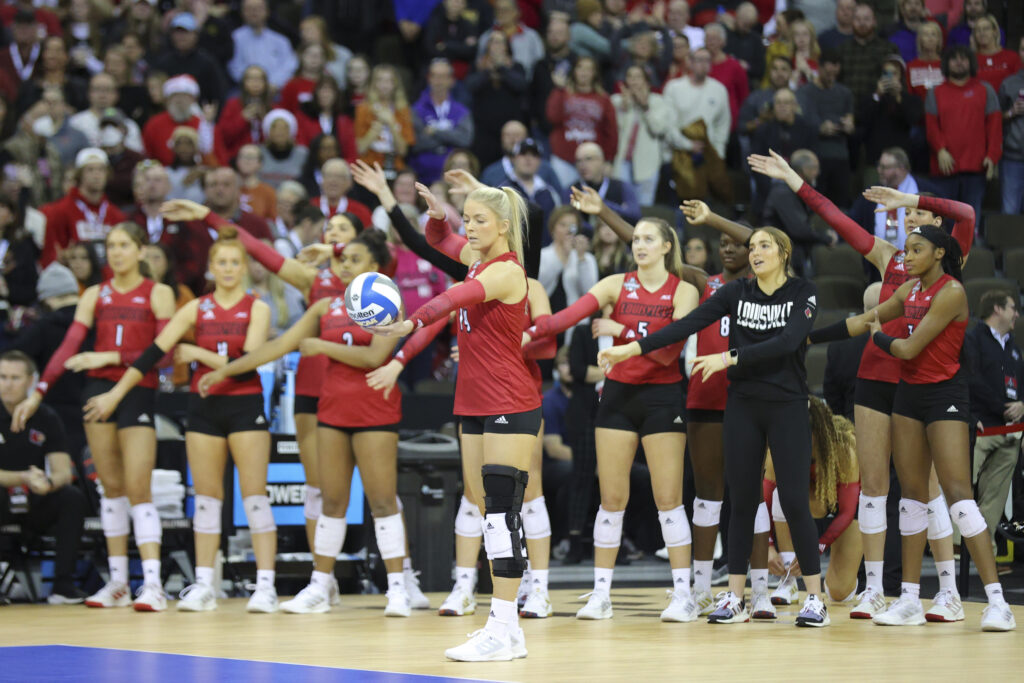 Louisville's Anna DeBeer prepares to serve during a match.