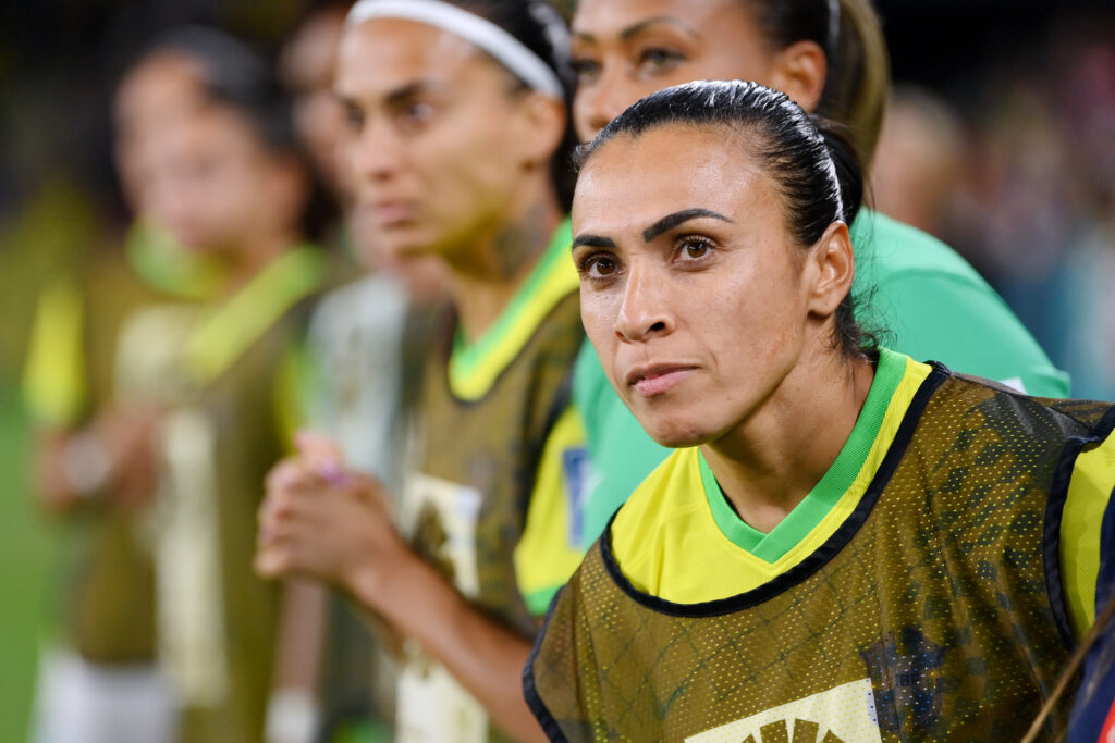 Brazil legend Marta stands with her teammates before a 2023 World Cup match.