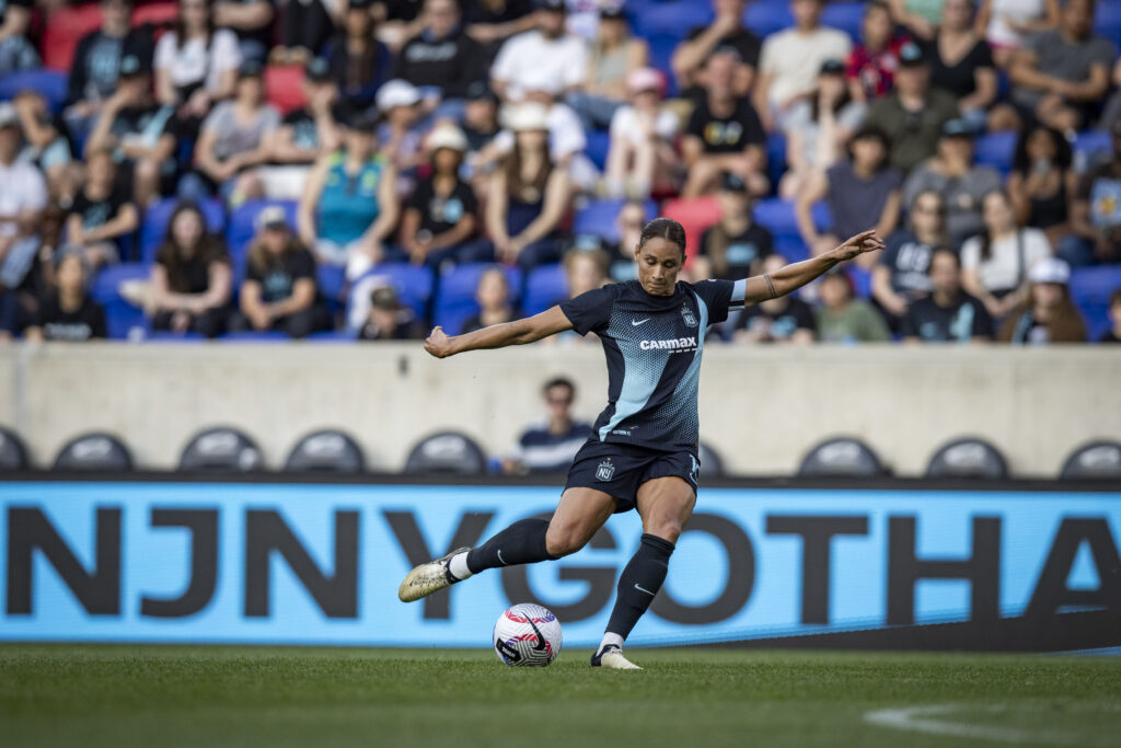 Gotham forward Lynn Williams strikes the ball during a match.