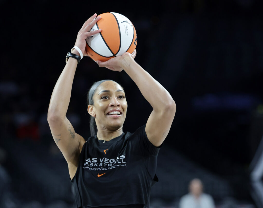 A'ja Wilson smiles while taking a shot in pre-game warmups.