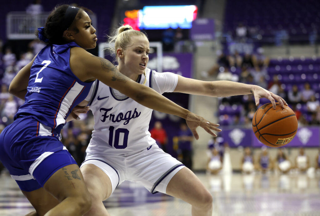 TCU star Hailey Van Lith battles Houston Christian's Victoria Dixon for the ball.