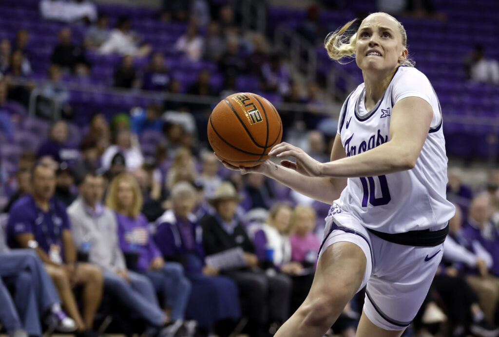 TCU guard Hailey Van Lith drive to the basket during a college ncaa basketball game.