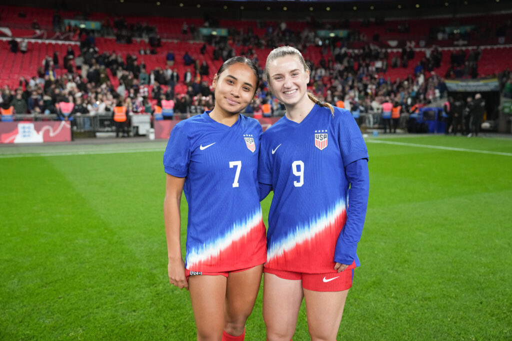 Alyssa Thompson and Ally Sentnor pose after the USWNT ties England at Wembley Stadium on Saturday.