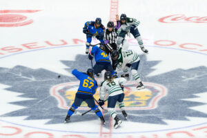 The referee drops the puck on the first game of the PWHL's second season between Toronto and Boston on Saturday.