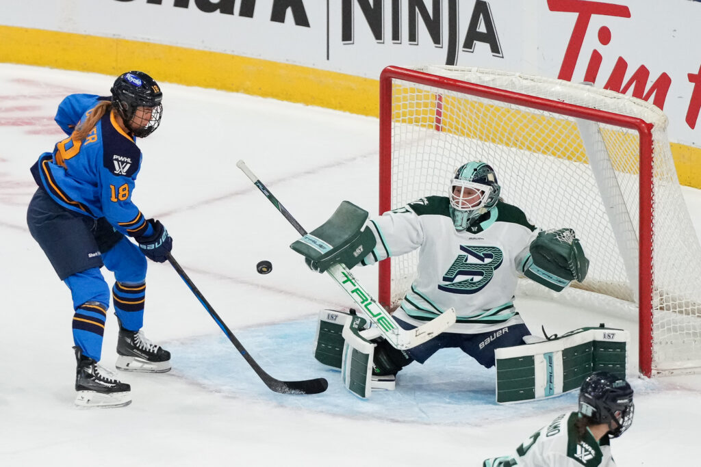 Boston goalie Aerin Frankel saves a shot in their Saturday PWHL season-opening loss to Toronto.