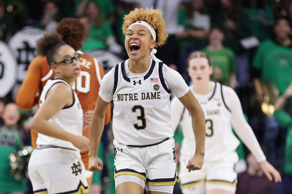 Hannah Hidalgo celebrates No. 10 Notre Dame's overtime upset women's college basketball win against No. 4 Texas.