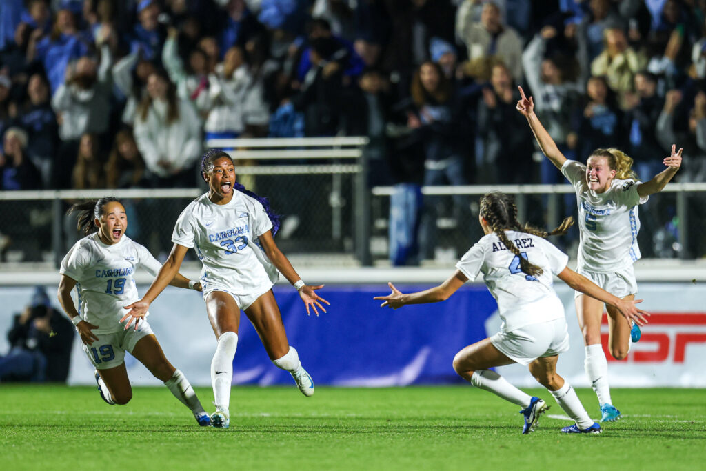 UNC attacker Olivia Thomas celebrates her championship-winning goal with her teammates in the 2024 College Cup final.