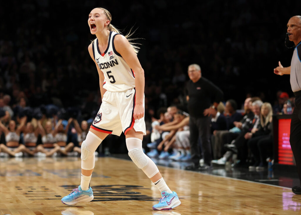 UConn's Paige Bueckers yells and reacts to a play during a game.