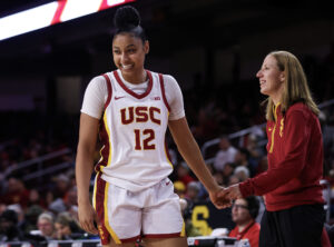 USC's JuJu Watkins low-fives her coach, Lindsay Gottlieb during a game.