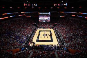 A wide view of Louisville's KFC Yum! Center packed with fans for the 2024 NCAA volleyball semifinals.