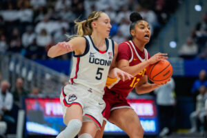 JuJu Watkins of USC is defended by Paige Bueckers of the Connecticut Huskies