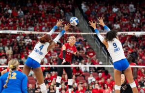 Louisville's Anna DeBeer spikes the ball against Pitt during a game.