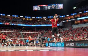 Louisville's Anna DeBeer serves the ball against Pitt during a 2024 NCAA volleyball match.