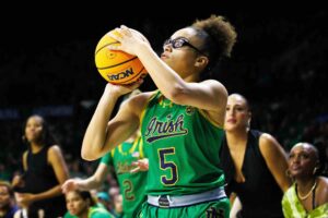 Notre Dame guard Olivia Miles shoots and scores a three point shot during a NCAA women's college basketball game between No. 8 Notre Dame and No. 2 UConn at Purcell Pavilion.