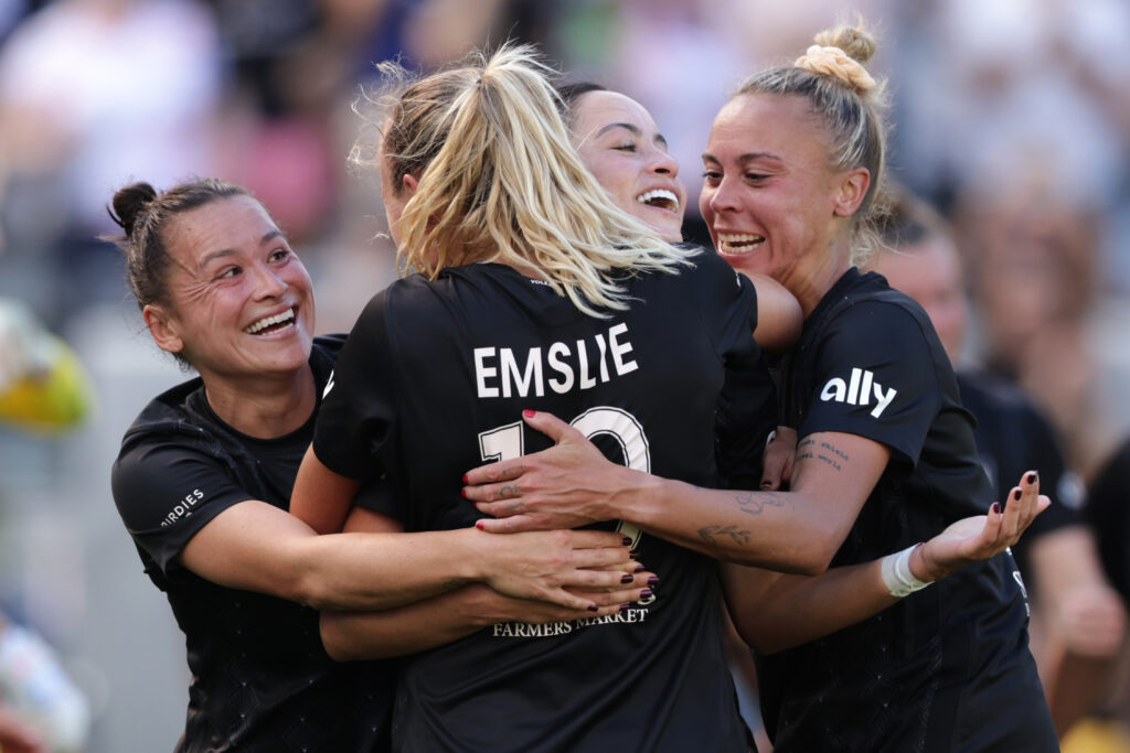 Angel City FC players celebrate a 2023 NWSL Decision Day goal.