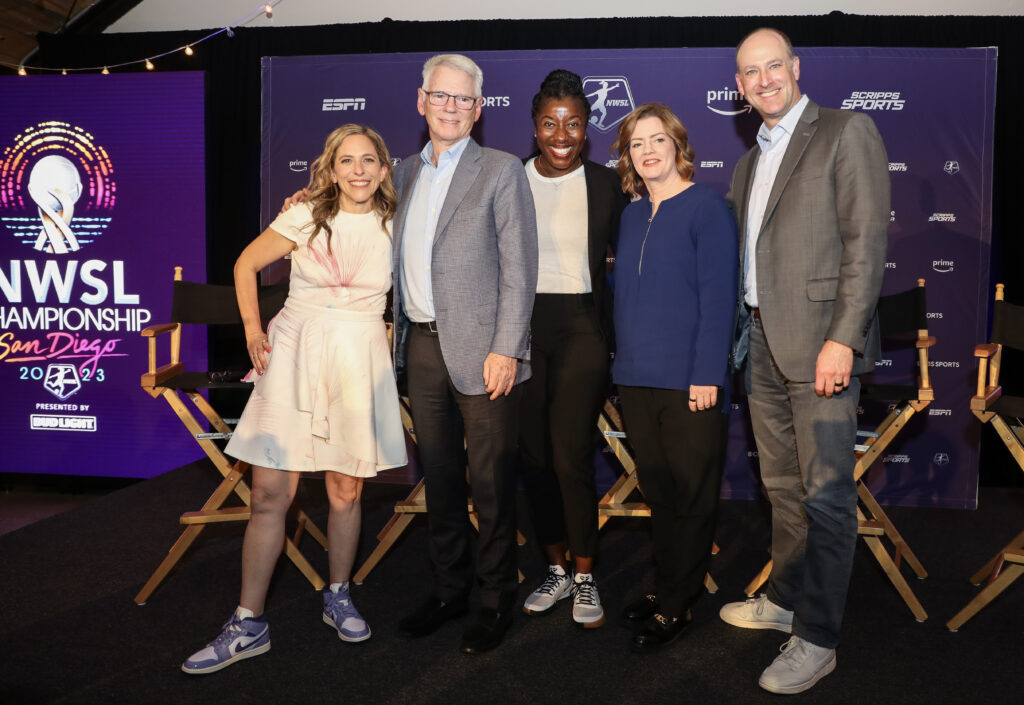 NWSL commissioner Jessica Berman poses with representatives from CBS, ESPN, Amazon, and ION while announcing the league's 2023 media deal.