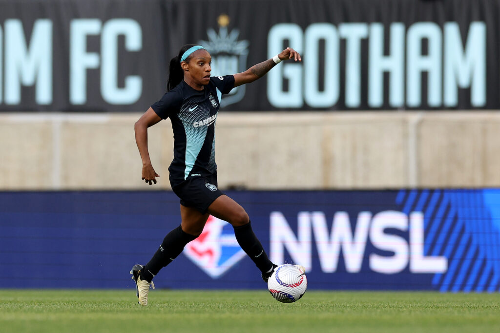 Crystal Dunn dribbles the ball during a Gotham FC match.