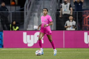 San Diego defender Naomi Girma dribbles the ball during a 2024 NWSL match.