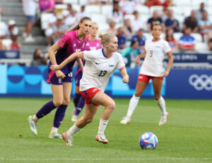 Defender Jenna Nighswonger controls the ball during the USWNT's 2024 Olympic semifinal against Germany.