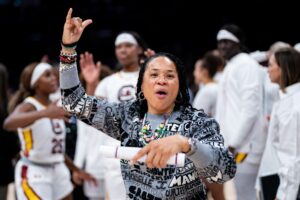 South Carolina basketball coach Dawn Staley celebrates a win.