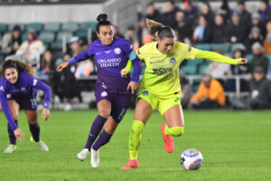 Orlando's Marta and Washington's Trinity Rodman battle for the ball during the 2024 NWSL Championship.