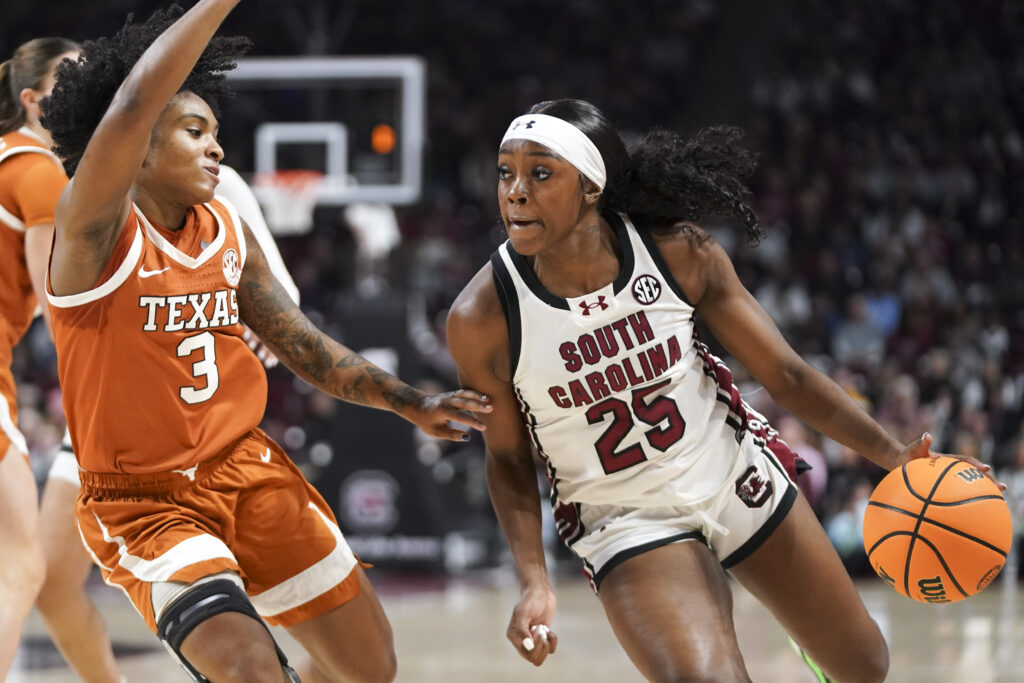 South Carolina's Raven Johnson dribbles against Texas's Rori Harmon during Sunday's NCAA basketball game.