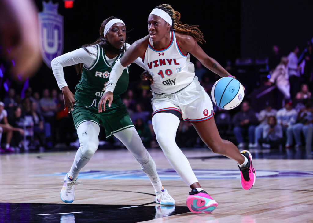 Vinyl's Rhyne Howard dribbles around Rose's Kahleah Copper in their Unrivaled game.