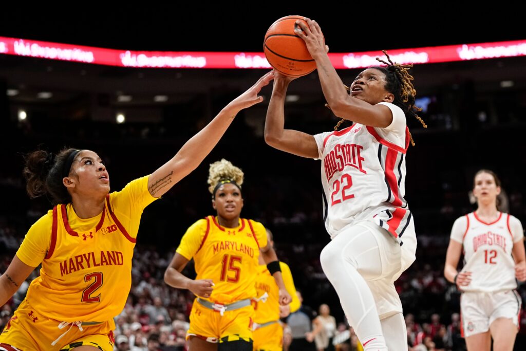 Maryland's Kaylene Smikle guards Ohio State's Jaloni Cambridge during a Big Ten NCAA college basketball game.