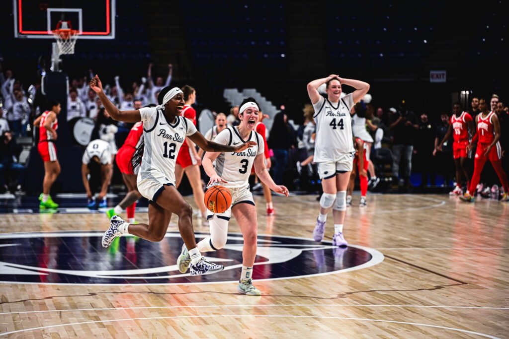 Penn State's Jayda Oden and Moriah Murray race across the court in celebration.