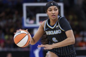 Chicago Sky star Angel Reese dribbles up-court during a 2024 WNBA game.