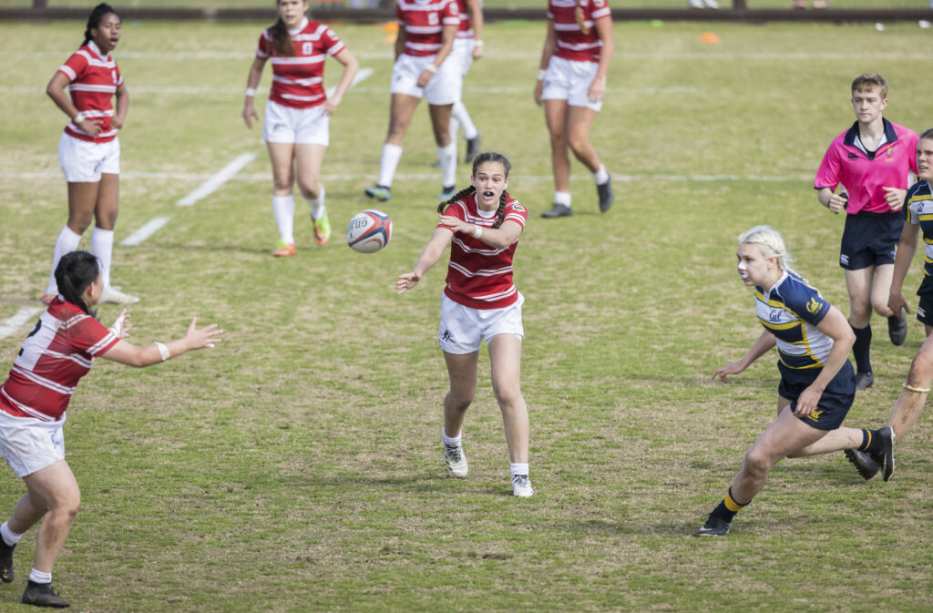 Stanford rugby's Dakota Bailey-Van Kuren passes the ball during a match against Cal.