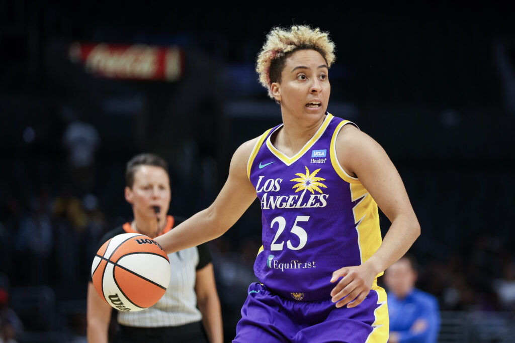 LA Sparks guard Layshia Clarendon dribbles the ball up the court during a 2024 WNBA game.