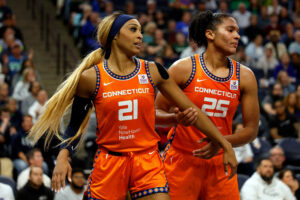 Connecticut's DiJonai Carrington and Alyssa Thomas look on during a 2024 WNBA semifinals game.