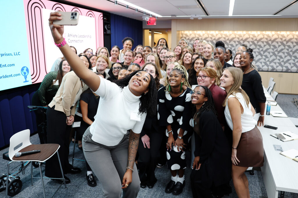 Attendees take a "selfie" with Sports Broadcaster Isis Young after a WSF workshop at the 2024 Women's Sports Foundation Athlete Leadership Connection.