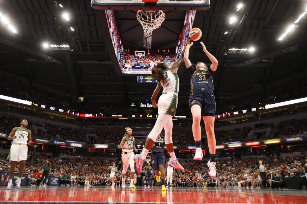 Indiana's Katie Lou Samuelson shoots the ball over Seattle's Ezi Magbegor during a 2024 WNBA game.