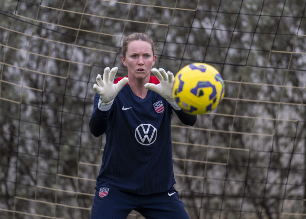 USWNT goalkeeper Mandy McGlynn saves a ball during a training session.