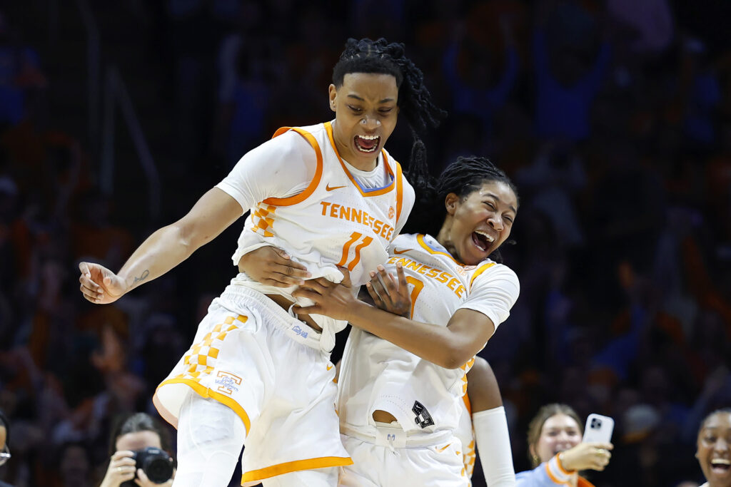 Tennessee basketball players Jewel Spear and Zee Spearman celebrate their 80-76 upset win over UConn.