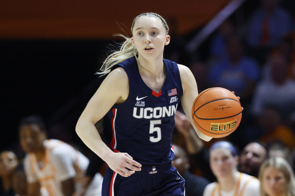 UConn star Paige Bueckers dribbles the ball during a game.