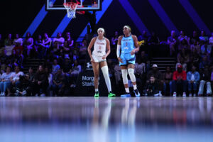 Rose BC's Angel Reese and Mist BC's Aaliyah Edwards stand on the Unrivaled court during a 3x3 game.