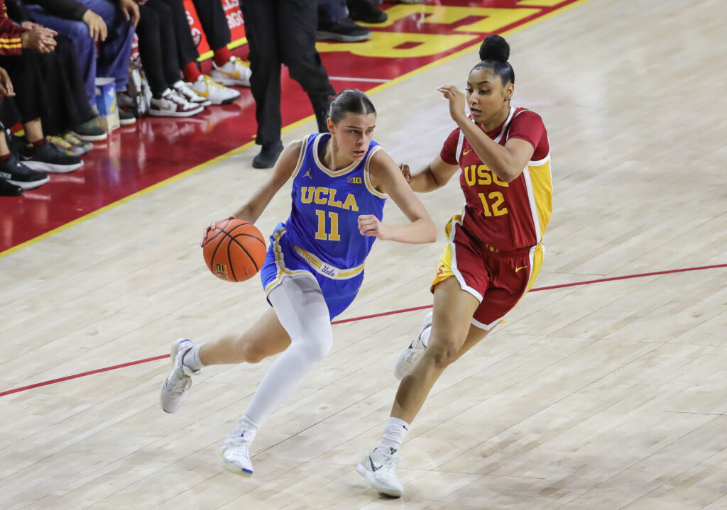 UCLA's Gabriela Jaquez dribbles past USC's JuJu Watkins during the rivals' February 13th game.