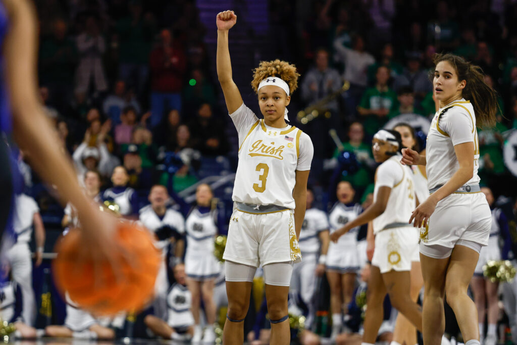 Notre Dame's Hannah Hidalgo raises her arm in celebration during Monday's win over Duke.