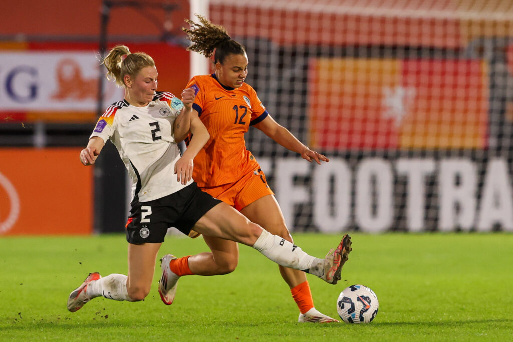 Dutch star Chasity Grant battles Germany's Sarai Linder for the ball during their 2025 UEFA Nations League opener.