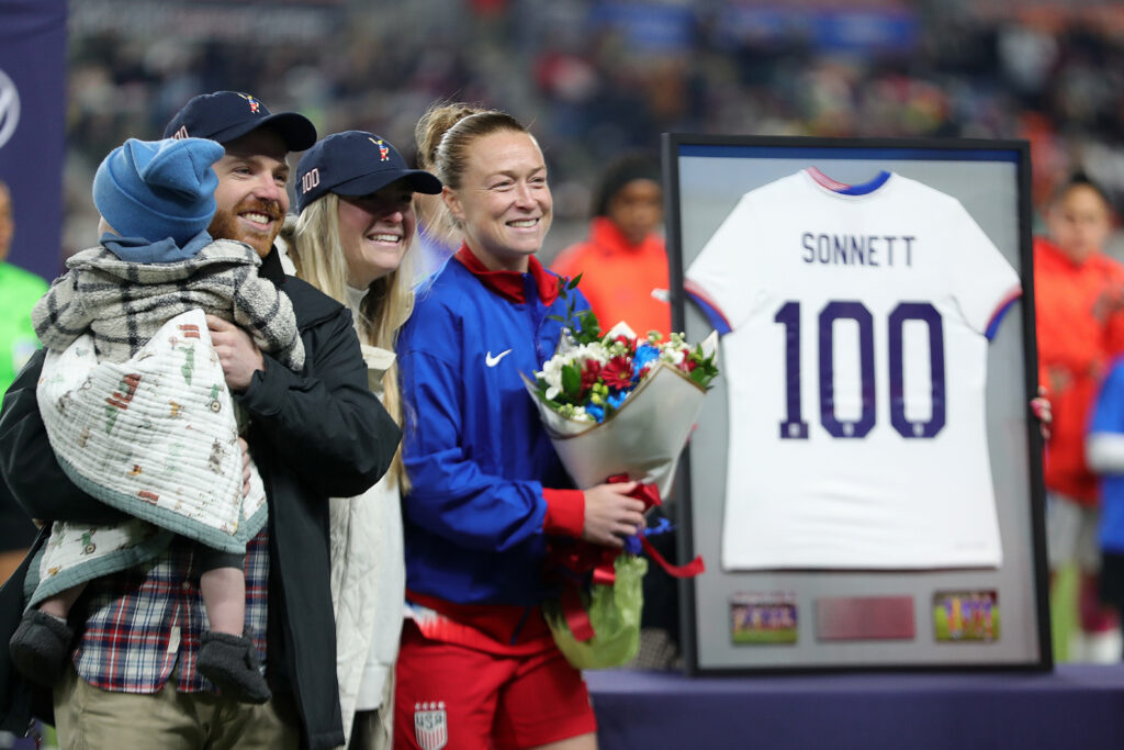 USWNT defender Emily Sonnett is honored for her 100 caps during a pre-match ceremony on Thursday.