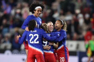 USWNT teammates celebrate Ally Sentnor's first international goal during Thursday's match.